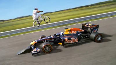 Jumping a Bike Over a Formula 1 Race Car